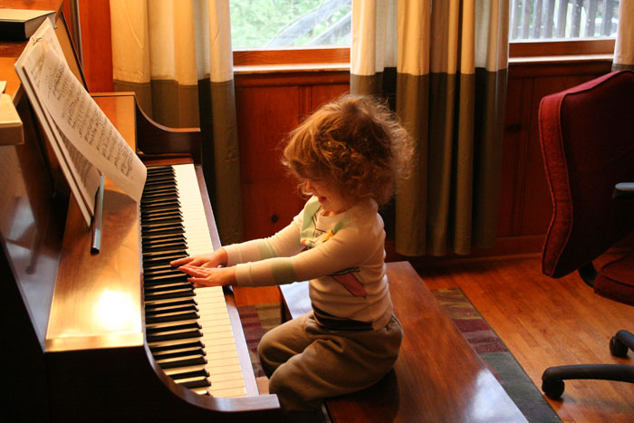 Laurey Beth George playing the piano for the first time.